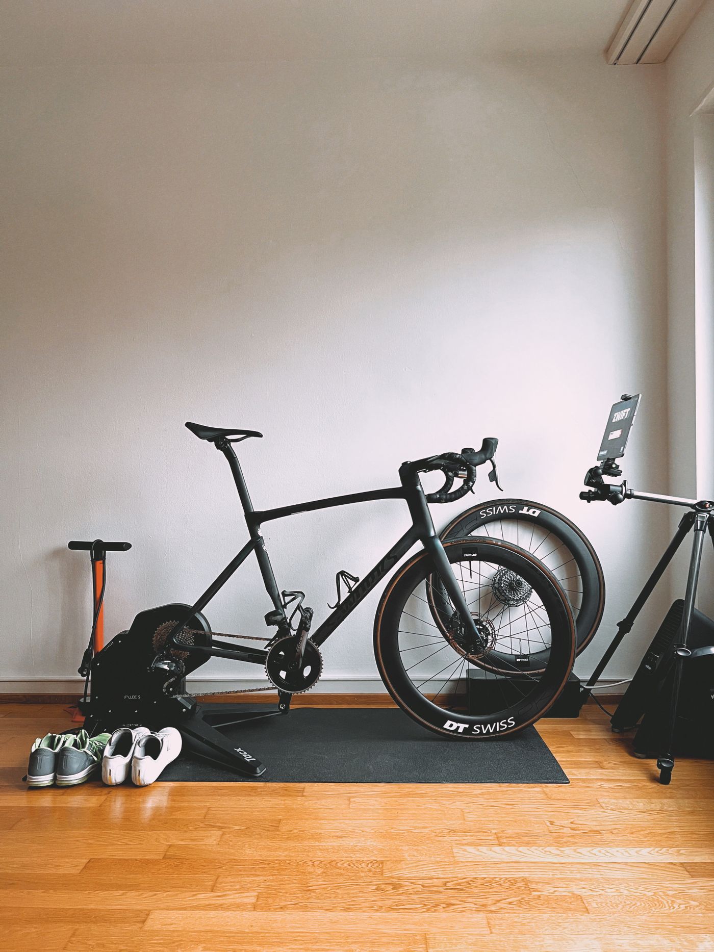 Tidy indoor training setup with a road bike